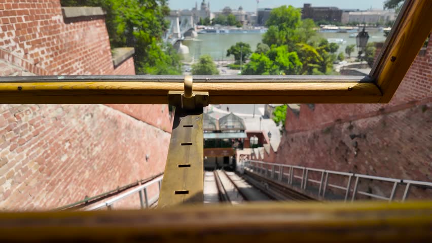 View from inside the Buda Castle Funicular in Budapest, Hungary, looking down the tracks during the climb between the Danube riverfront and historic Castle Hill.