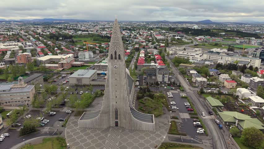 Aerial view of the iconic Hallgrimskirkja lutheran church, a famous landmark towering over the city of Reykjavik, the capital of Iceland
