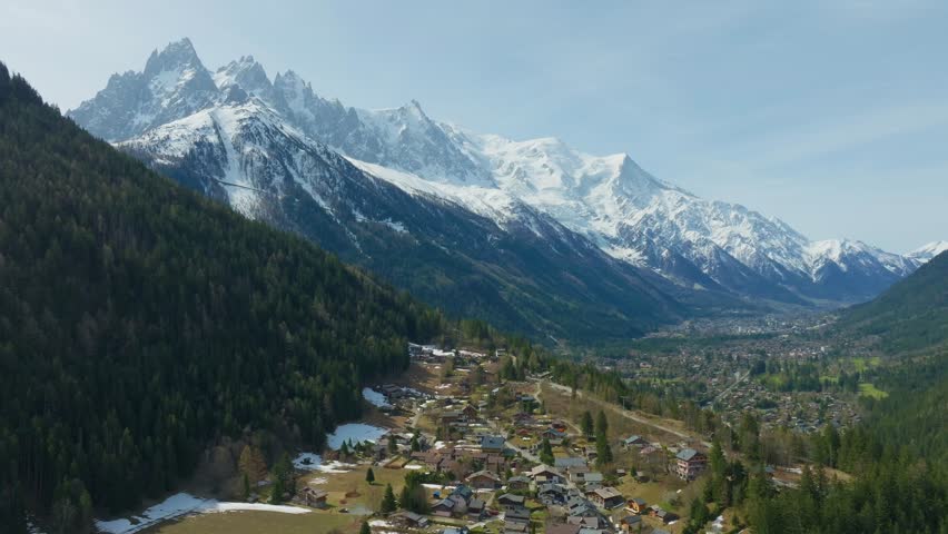 Aerial View Of Houses In The Le Lavancher Village With Chamonix and Mont Blanc In Haute-Savoie, France. - forward shot