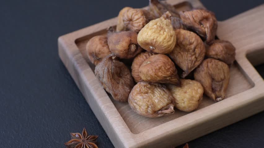 Dried fig are a sweet, healthy fruit for vegans and vegetarians. Dried fig as a food background