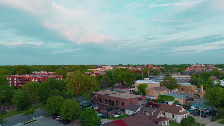 Red brick apartments and leafy residential neighborhoods in the affluent North Shore suburb of Highland Park, Illinois, with Lake Michigan on the horizon.