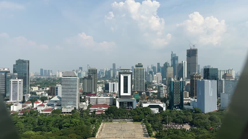 Jakarta, Indonesia - 26 Mei 2026 :A view of Jakarta from the top of the National Monument during a clear day. Tall buildings in Jakarta. City Jakarta.