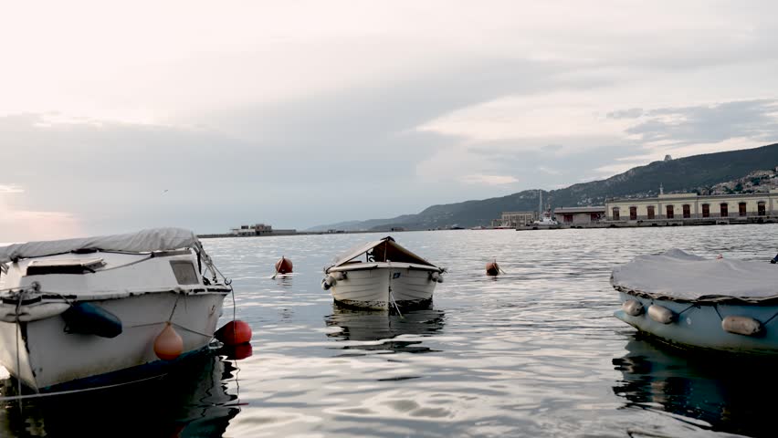 boats near the sea shore at beautiful sunset