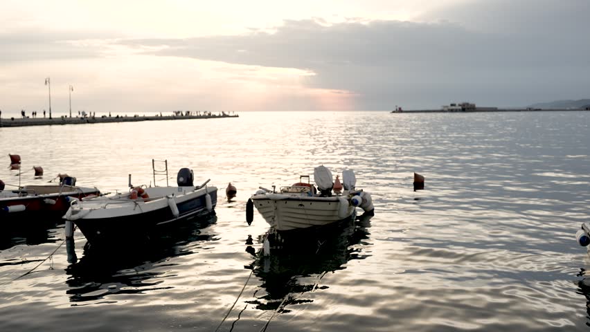 boats near the sea shore at beautiful sunset