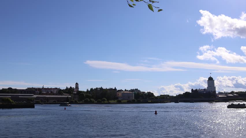 A small boat sailing on a peaceful lake.