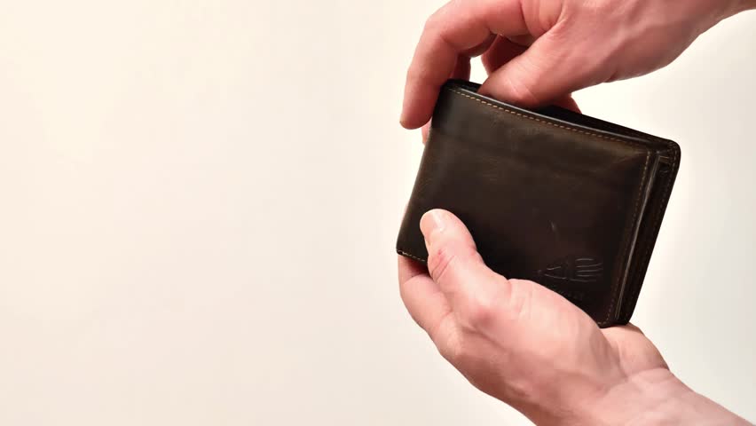 lack and shortage of money.empty wallet in the mans hands.Low salary. Lack of funds. Budget deficit and poverty concept. 4k footage