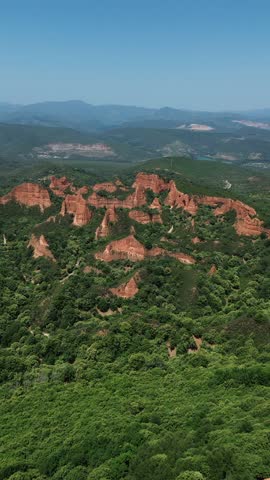 Aerial drone footage of Las Médulas Spain ancient Roman gold mines and spectacular red rock landscape in León