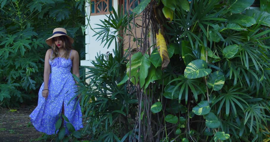 Indian girl, blue floral midi dress, rustic wooden boardwalk, dense forest environment, natural lighting, 8k resolution.
