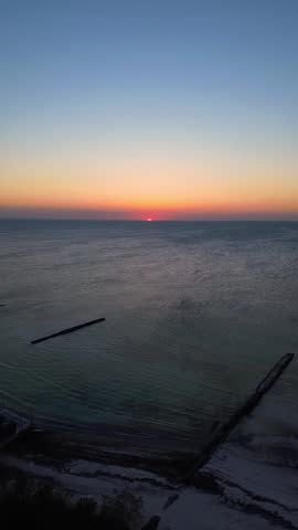Aerial drone view of stunning long sunset over beach and sea golden hour Yucatan Mexico