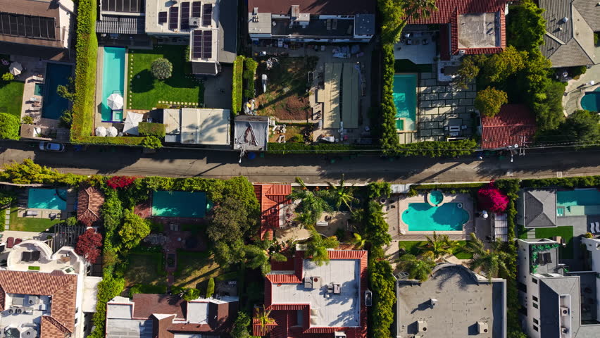 Beverly Hills, Los Angeles California USA, Flying Above Upscale Homes With Pools, Birds Eye Drone Shot