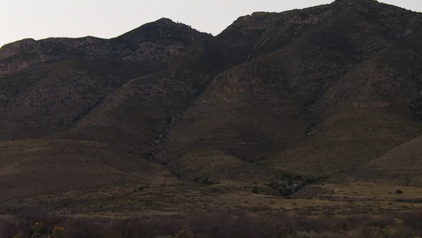 Establishing daytime shot of Sliding Sands volcanic valley surrounded by rugged mountain ridges in Haleakalā National Park, Maui, Hawaii, United States