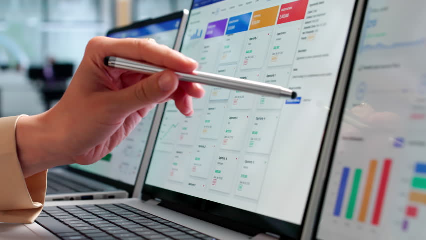 Sales Manager Reviewing Customer Data On Laptop To Improve Business Growth.