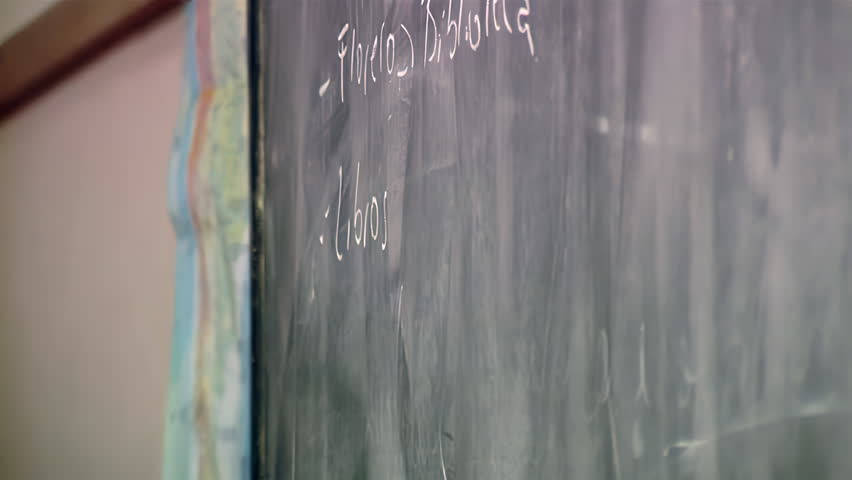 Teacher Writing Lesson On Traditional Blackboard In Argentine Public School - 4K