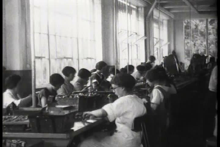1910s - People work in factories in 1919.