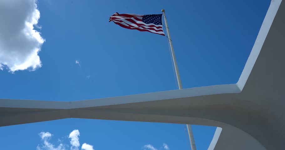 American flag waving from Pearl Harbor, Hawaii USS Arizona