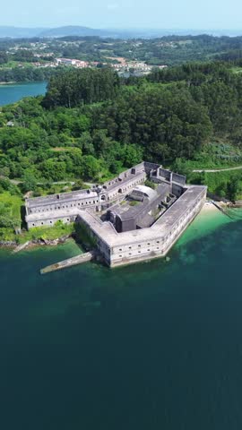 Aerial drone footage of Palma Castle Spain coastal fortress overlooking the Ferrol estuary in Galicia