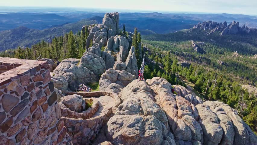 Panoramic view from Black Elk Peak overlooking granite formations and forested landscapes in South Dakota