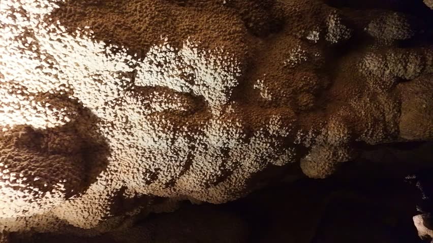 Close up view of glowing calcite crystal formations inside Jewel Cave in South Dakota