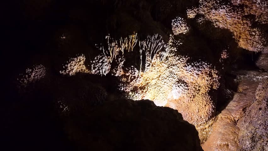 Close up view of glowing calcite crystal formations inside Jewel Cave in South Dakota