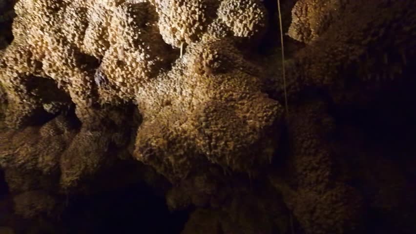 Close up view of glowing calcite crystal formations inside Jewel Cave in South Dakota