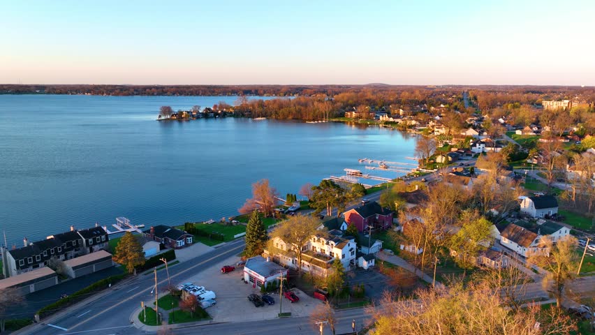 Waterfront residential houses aerial view in the morning on Walled Lake in city of Walled Lake, Michigan MI, USA. 