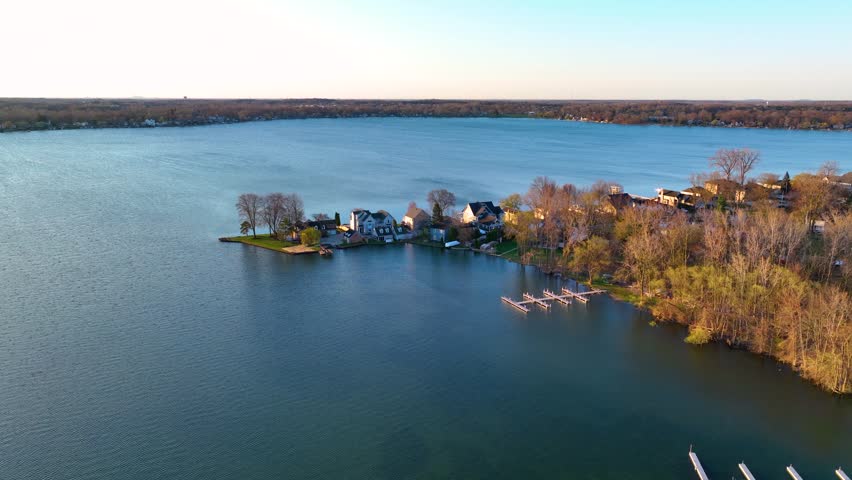 Waterfront residential houses aerial view in the morning on Walled Lake in city of Novi, Michigan MI, USA. 