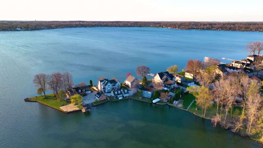 Waterfront residential houses aerial view in the morning on Walled Lake in city of Novi, Michigan MI, USA. 