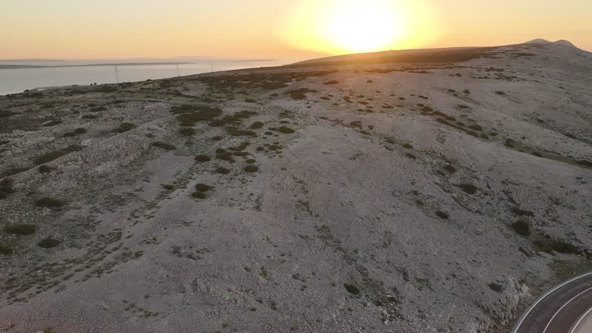 Golden Sunset Over the Rocky Landscape of Pag Island