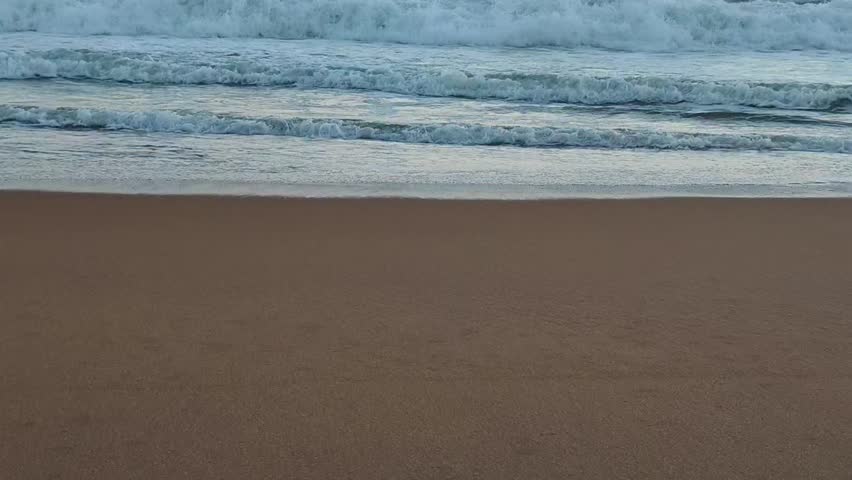 Ocean Waves Crashing on a Sandy Beach