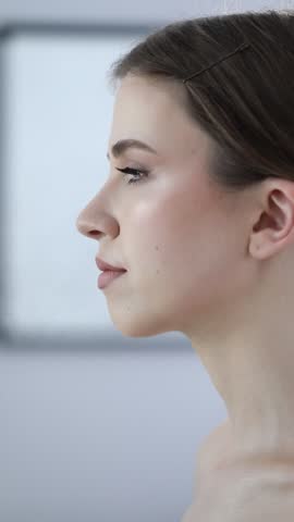Woman with beautiful makeup indoors, camera moving in