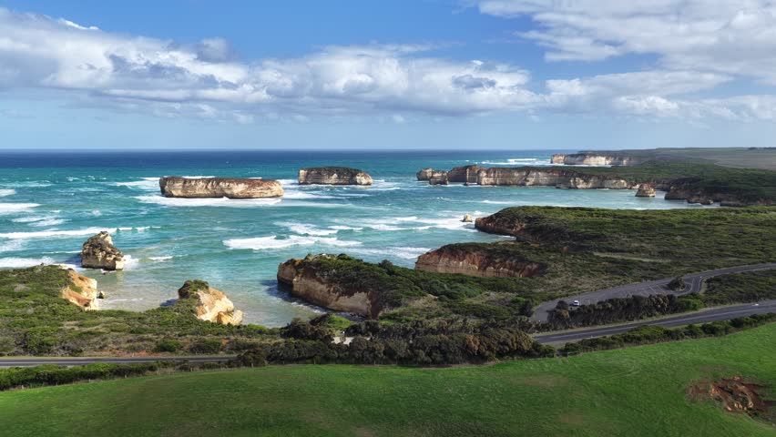 Bay of Islands Coastal Park, Peterborough, Victoria, Australia: 4K aerial drone footage of limestone cliffs, ocean waves, rock stacks and Great Ocean Road coastline.