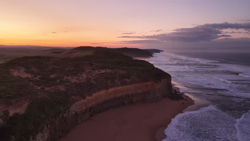 Gibson Steps and Port Campbell National Park, Great Ocean Road, Victoria, Australia: 4K aerial drone footage of cliffs, beach, ocean waves and coastal landscape near Twelve Apostles at sunrise. 