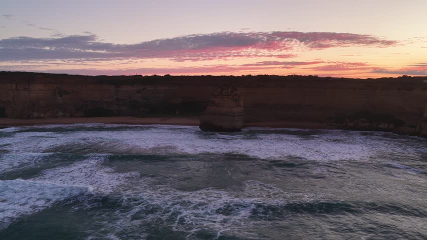 Gibson Steps and Port Campbell National Park, Great Ocean Road, Victoria, Australia: 4K aerial drone footage of cliffs, beach, ocean waves and coastal landscape near Twelve Apostles at sunrise. 