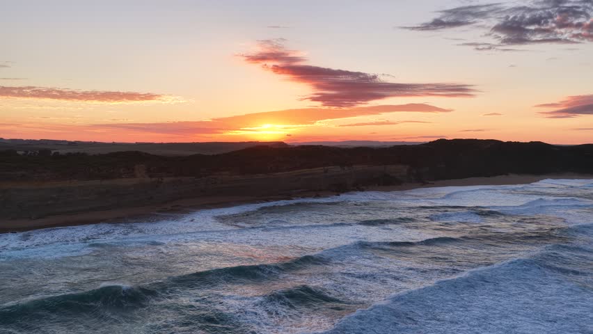 Gibson Steps and Port Campbell National Park, Great Ocean Road, Victoria, Australia: 4K aerial drone footage of cliffs, beach, ocean waves and coastal landscape near Twelve Apostles at sunrise. 