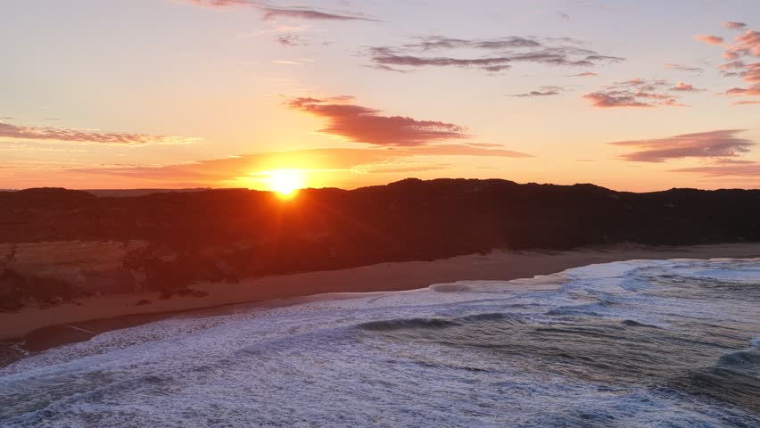 Gibson Steps and Port Campbell National Park, Great Ocean Road, Victoria, Australia: 4K aerial drone footage of cliffs, beach, ocean waves and coastal landscape near Twelve Apostles at sunrise. 