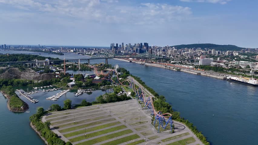 Aerial view of Montreal skyline, Jacques Cartier Bridge and La Ronde amusement island on St Lawrence River. g.