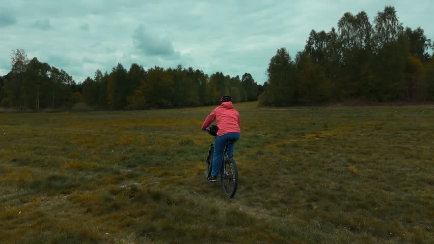 Outdoor recreation with cyclist on forest trail