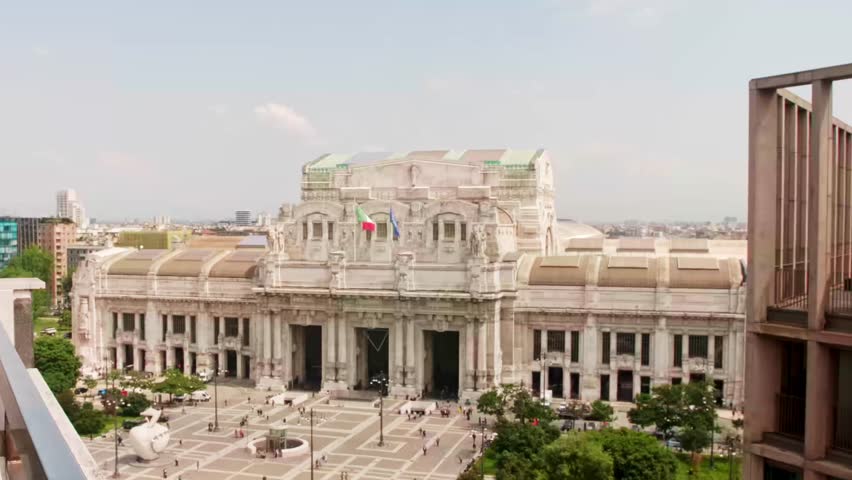 High-angle view of the historic milan central railway station. People walking in piazza duca d