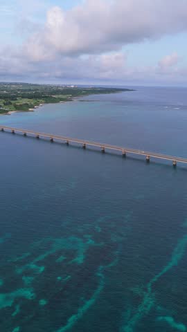 Kurima Bridge - Yonaha Beach And Yonaha Maehama Port In Shimoji, Miyako Island, Okinawa, Japan. - aerial vertical pan shot