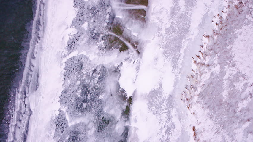 Aerial view of the Great Lakes surface decorated with intricate winter ice formations.