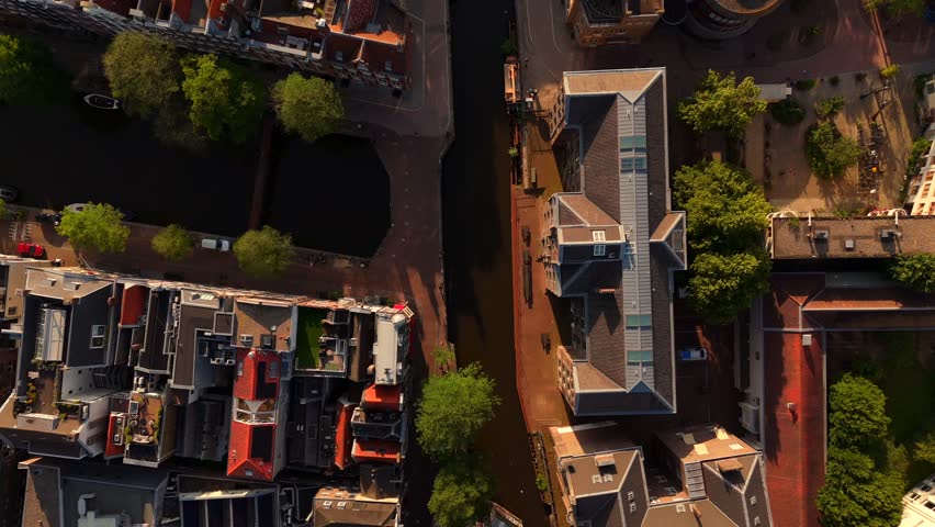Amsterdam Drone View of Historic Street with Aerial Work Platform and City Buildings