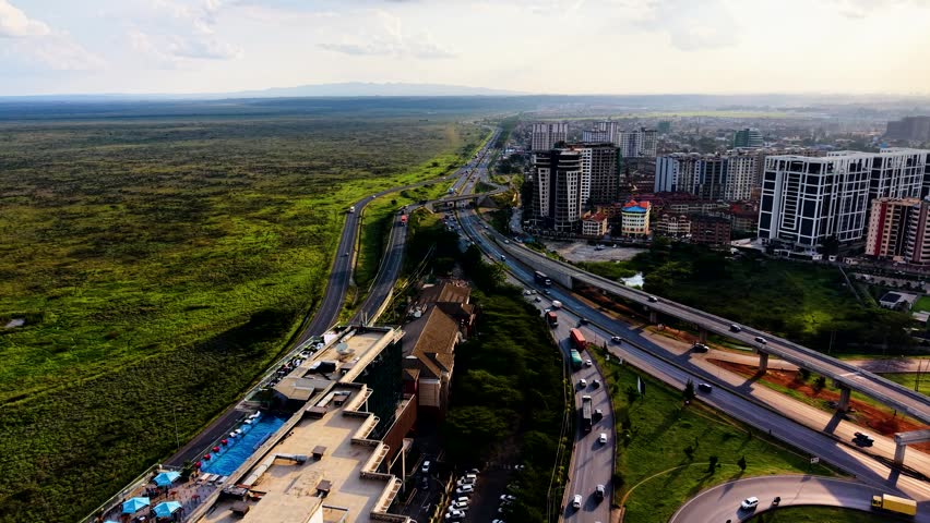 cars moving on nairobi roads nairobi road interchange nairobi expressway life kenya urban roads transport modern high way roads in Africa city traffic