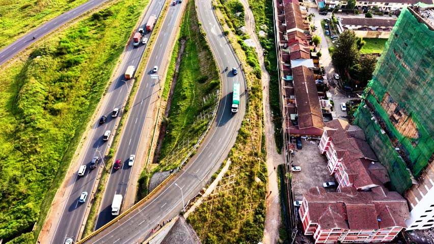 cars moving on nairobi roads nairobi road interchange nairobi expressway life kenya urban roads transport modern high way roads in Africa city traffic
