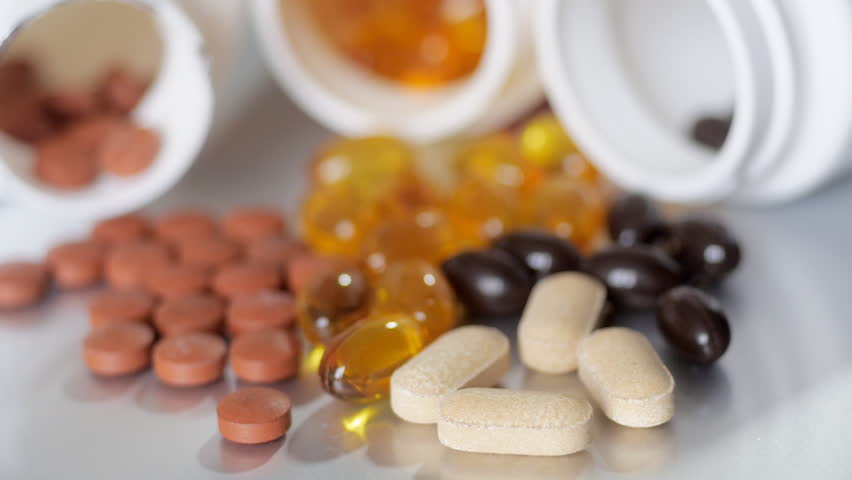 Rack focus to vitamin pills turning