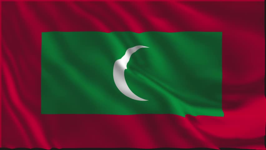 Flag of the Maldives waving slowly in the foreground.