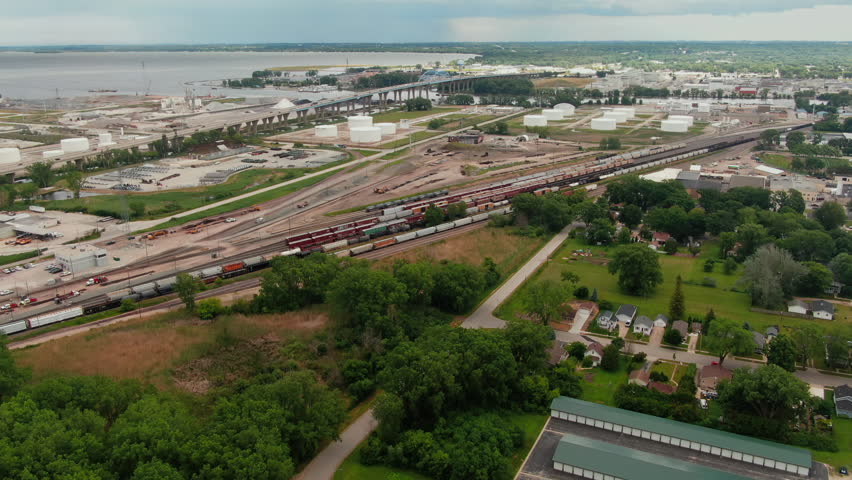 Aerial flying towards railway yard. Lake Michigan in background. Green Bay, Wisconsin, USA