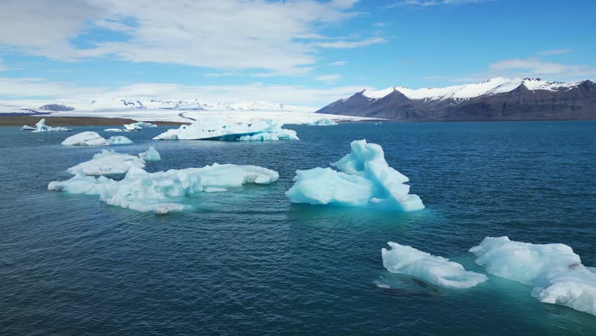 
Blue icebergs on a blue lake, broken off from a glacier