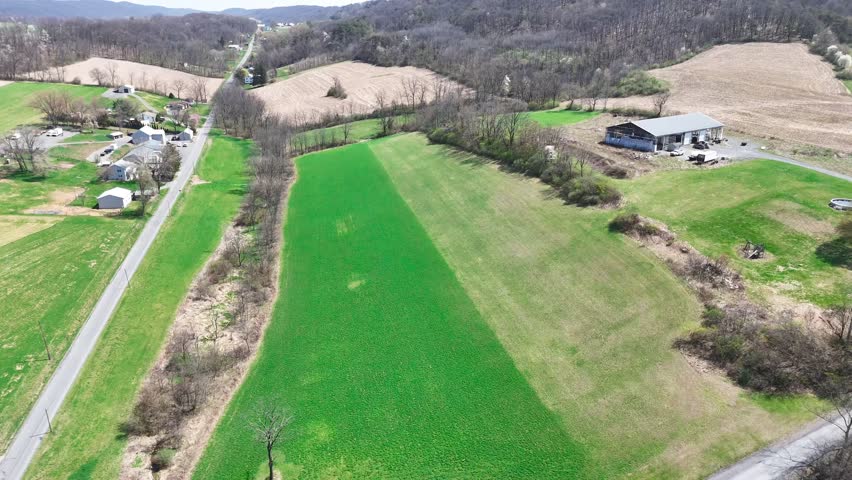 Aerial view of farmland and rural road through fields near Herndon Pennsylvania