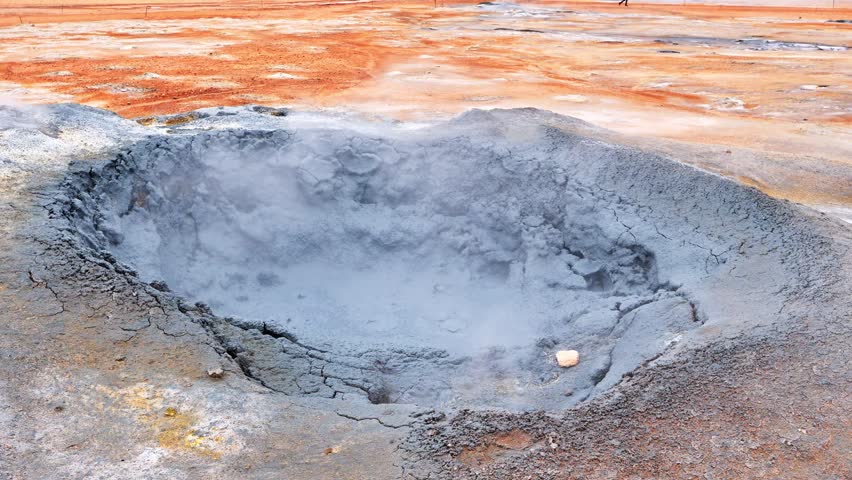 Boiling water in a mud spring in Hverir geothermal spring in Iceland