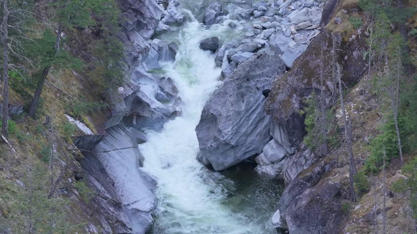 Powerful River Rapids Rushing Through a Deep Rocky Canyon in Beautiful British Columbia, Canada
